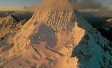 Climbers ascending steep ice during the Alpamayo Climbing Expedition summit push