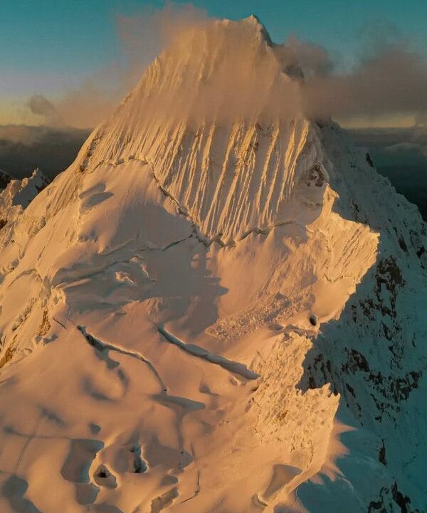 Climbers ascending steep ice during the Alpamayo Climbing Expedition summit push