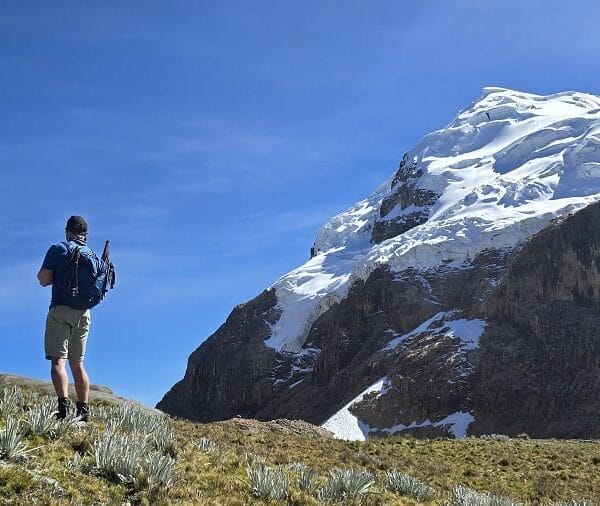 Huayhuash Trek Classic crossing a high mountain pass with Yerupajá peak in the background
