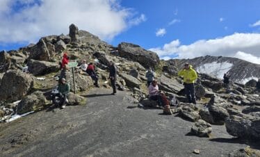 Hikers ascending Cuyoc Pass on the Huayhuash Trek Classic at high altitude in Peru