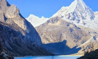 Laguna Paron Tour Cordillera Blanca surrounded by Artesonraju and Piramide de Garcilaso