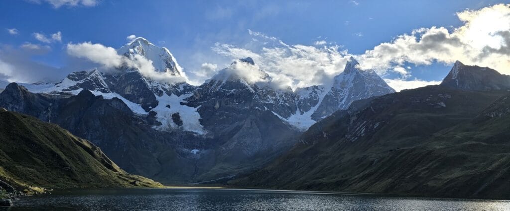 Hikers crossing an Andean mountain pass during a multi day trek