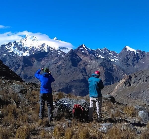 Trekkers approaching Huapi Pass at 16,470 ft in the Cordillera Blanca