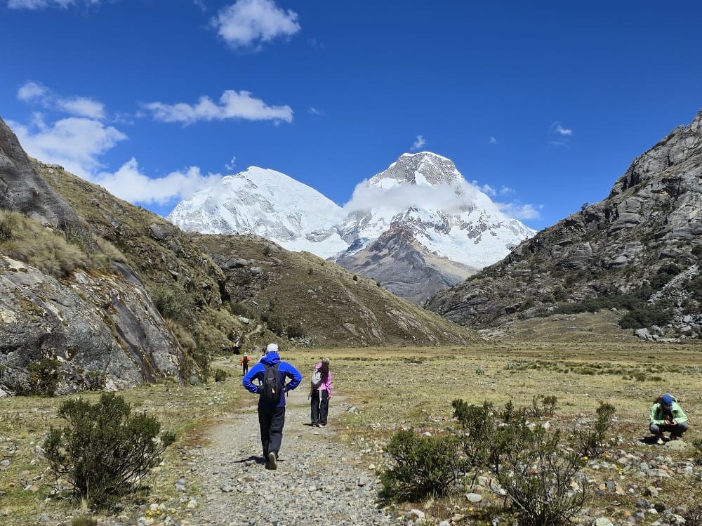 Hiker overlooking the Cordillera Blanca during an acclimatization walk